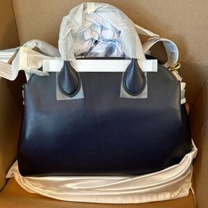 Brand new with tags. Coveted Coach Soft Empire Carryall Bag 40.
